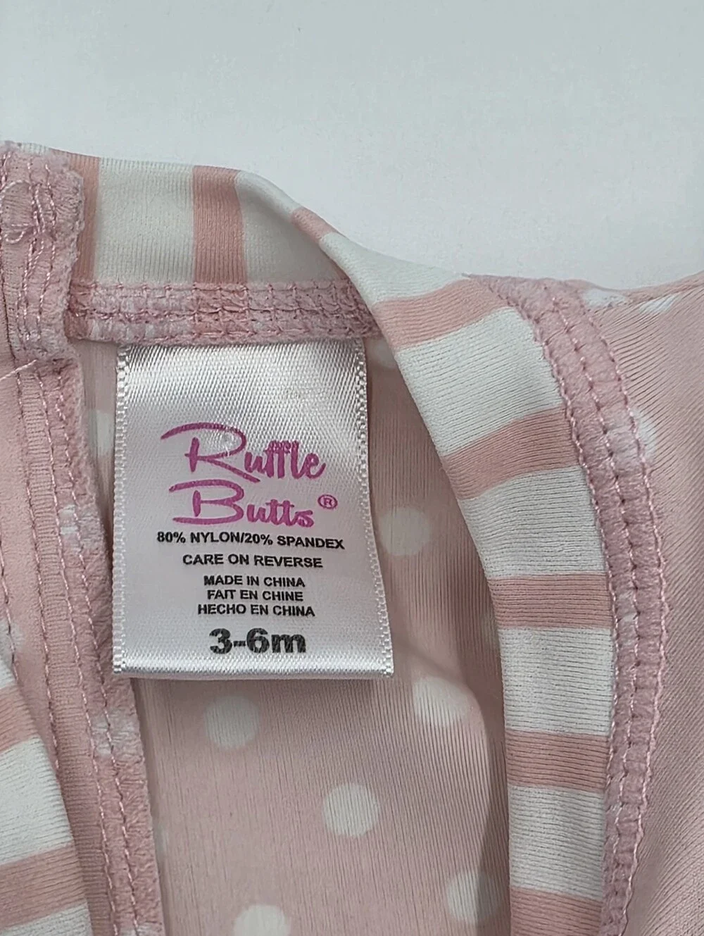 RuffleButts baby girl pink rashguard swimsuit size 3-6 months